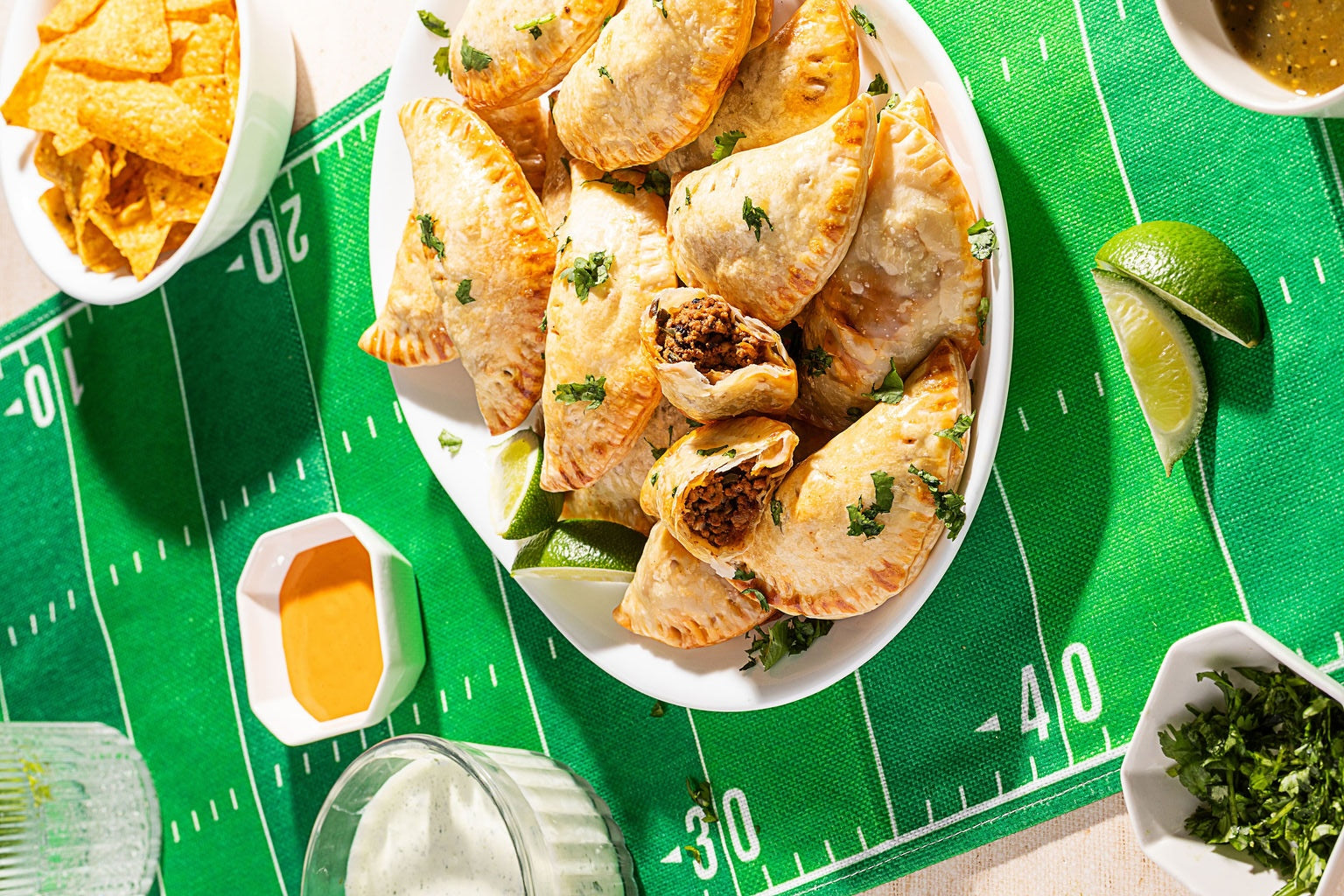 
                Texas Beef Empanadas with Jalapeño-Cilantro Crema
              